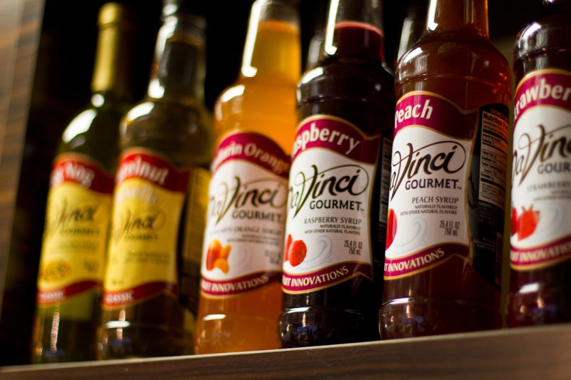 several bottles of syrup with different flavors